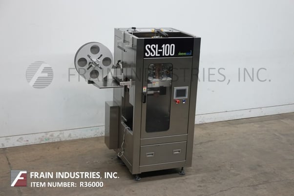 Sleeve Seal #SSL-100, automatic sleever labeler, rated from 10-100 sleeves per minute, with 20" OD label reel - Image 1