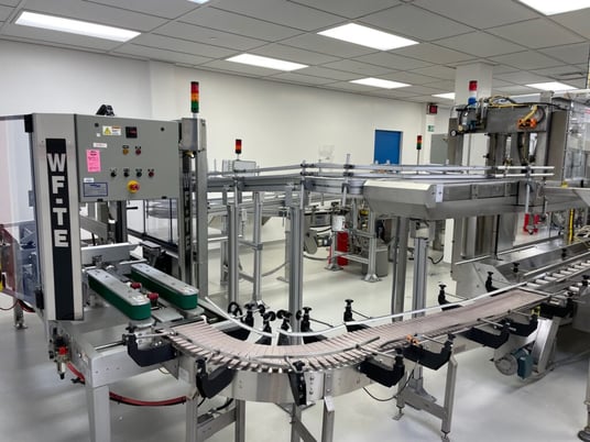 Wexxar #WFTE, automatic case erector, bottom taper, 5-15 cases per minute, mounted onm 4 leveling leg frame - Image 3