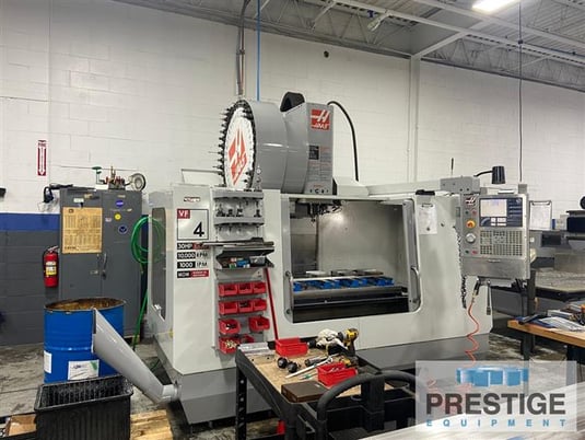 Haas #VF-4B, 50" X, Cat 40,10000 RPM, 30 HP, 40 side mount tool changer, chip auger, pre-wired 4th Axis - Image 1