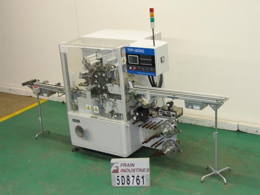 Tenchi #TP-200, automatic, intermittent motion, 8-station rotary, roll overwrapper rated from 40-120 packages - Image 1