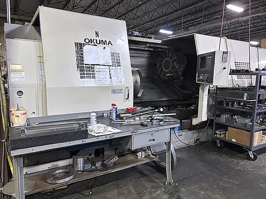 Okuma #LB-45-II, CNC Lathe, 33.8" Swing, 24" 3-Jaw Chuck, 10" Bore, 78.7" Turn length, 50 HP, 24-2800 RPM - Image 1