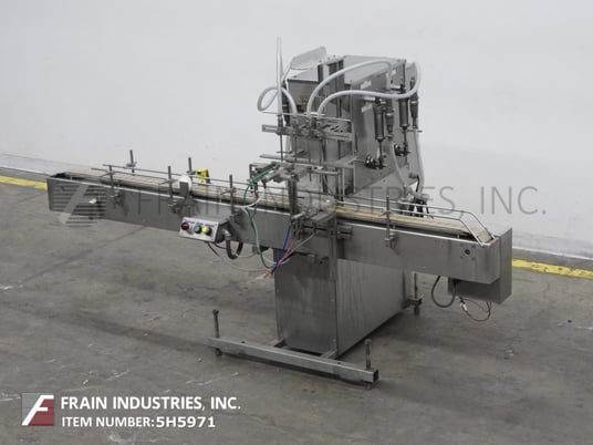 Image 1 for Filamatic #S-16, 4 head inline piston filler, 12-60 bottles/minute, 60-520ml, star wheel indexing