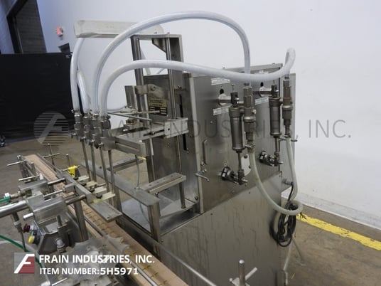 Image 2 for Filamatic #S-16, 4 head inline piston filler, 12-60 bottles/minute, 60-520ml, star wheel indexing