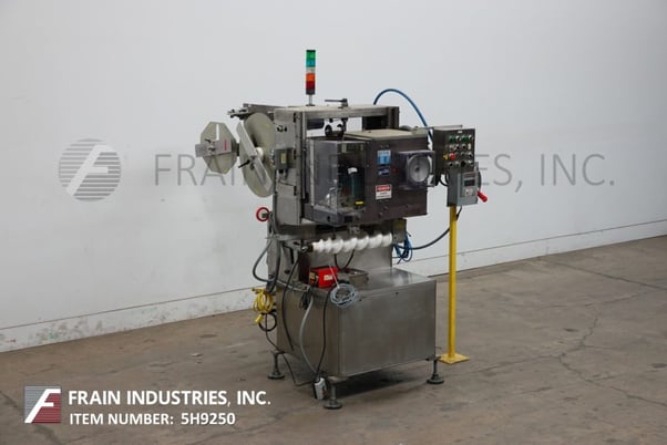 Image 1 for PDC Intl. Corp #75M, automatic shrink sleeve labeler, tamper evident neck bander and shrink tunnel rated from 0-300 containers per minute