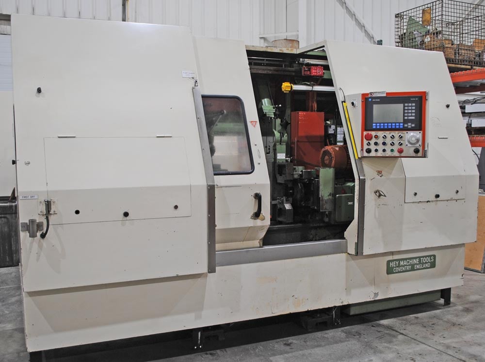 8" x 27" Hey #3, CNC facing & centering machine, 2-air vises, chip conveyor, AB Control, 1999 - Image 5