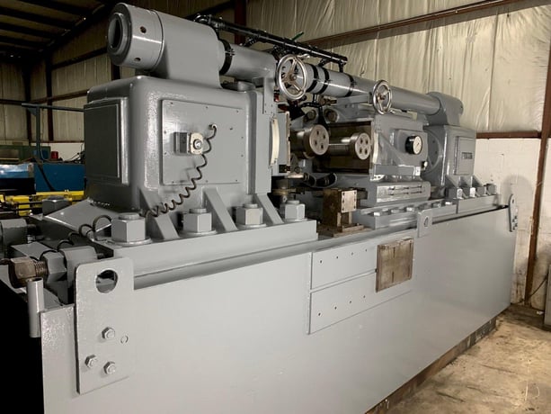 24" Tesker #840, infeed/thrufeed, 20' infeed rolling table, 20' exit rolling table - Image 2