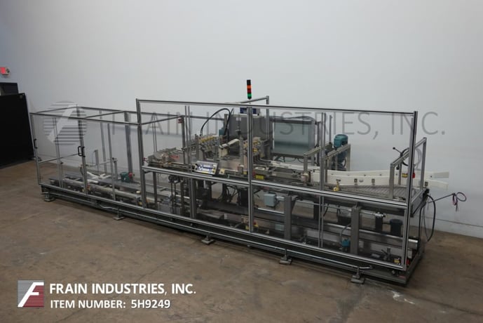 Hartness #825, automatic, intermittent motion, ascending, drop case packer rated from 10-30 cases per minute - Image 1
