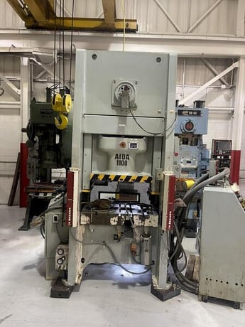 121 Ton, Aida #NS1-1100, single point eccentric geared straight side press, 4.3" stroke, 2001 - Image 1