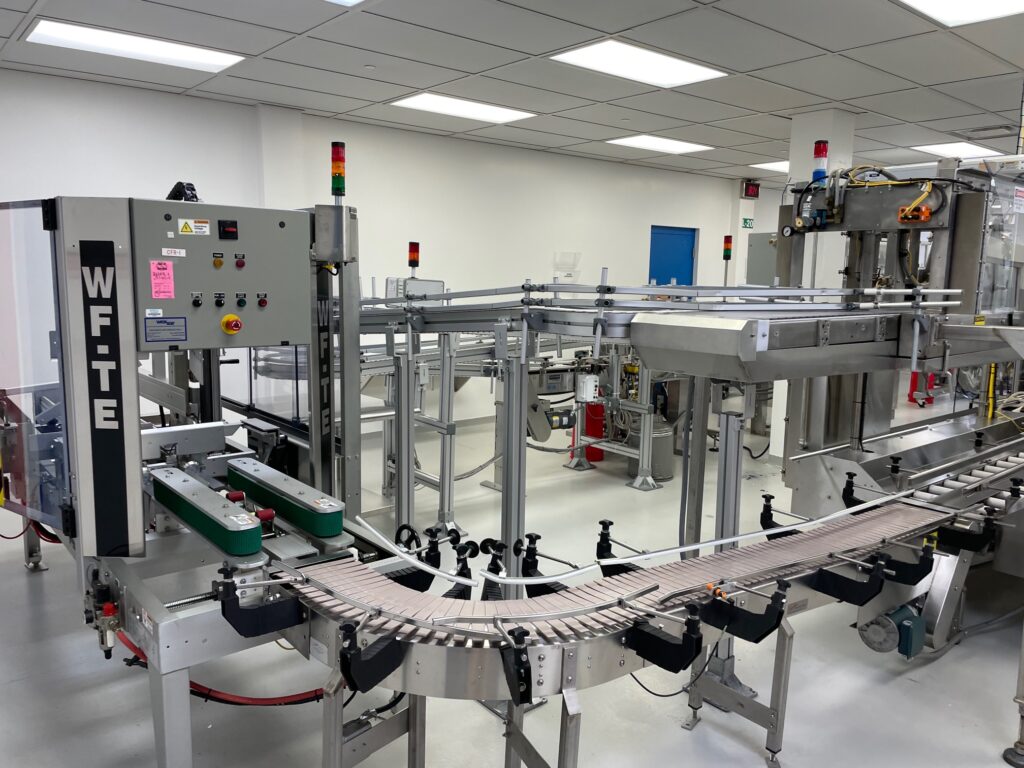 Wexxar #WFTE, automatic case erector, bottom taper, 5-15 cases per minute, mounted onm 4 leveling leg frame - Image 3