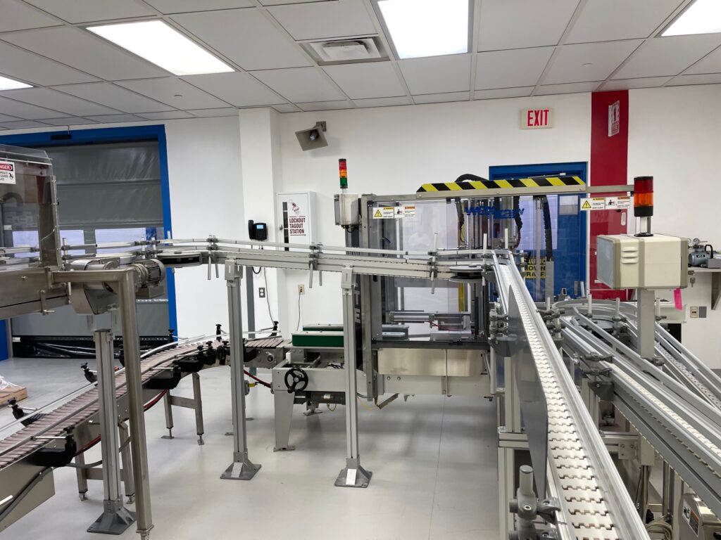 Wexxar #WFTE, automatic case erector, bottom taper, 5-15 cases per minute, mounted onm 4 leveling leg frame - Image 4