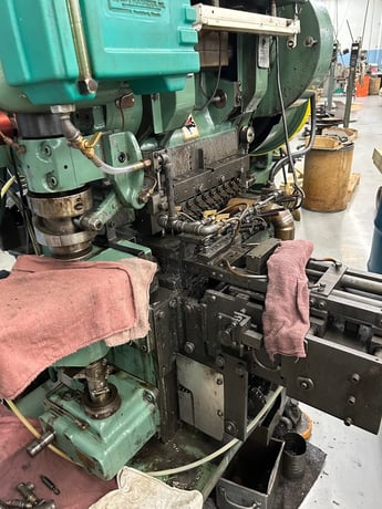25 Ton, U.S. Baird #3-25, eyelet & transfer press, 2" stroke, 11 operation die set, Bijur Versa 3 automatic - Image 2