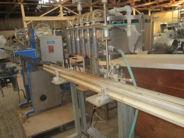 Pressure Bottle Filler, 6-Head inline, 5/8" diameter Nozzles, pneumatically foot actuated - Image 1