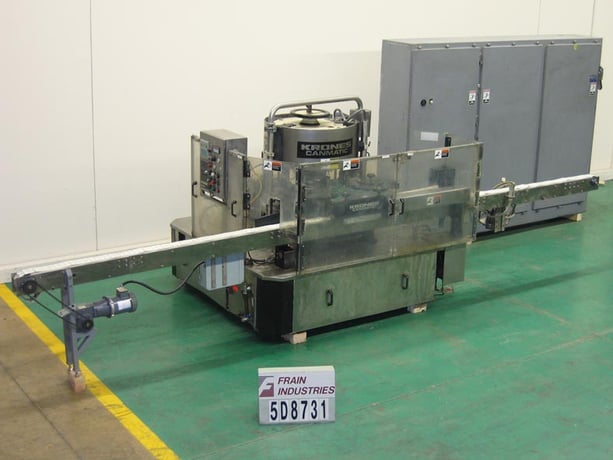 Krones #Canmatic, fully automatic, 12-head rotary, hot melt glue, wrap around labeler for pre-cut paper - Image 1
