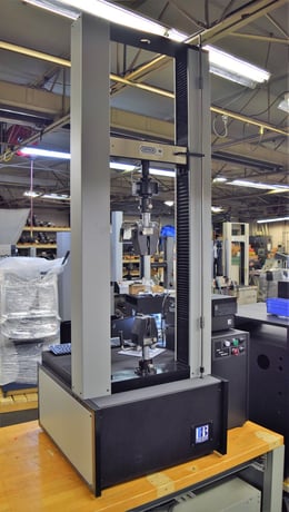 5625 lbf. MTS #QTest-25, tensile tester, 48" opening, 16" btwn screws, 48" stroke, 16" x 4" table - Image 1