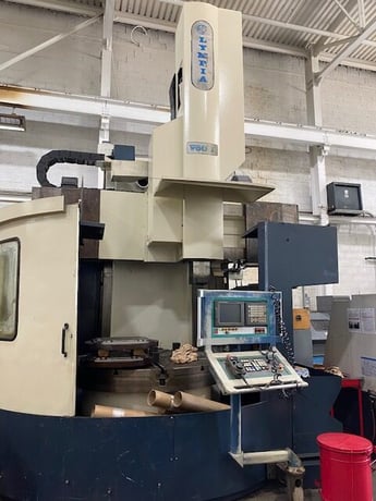 Olympia #V60L, CNC vertical turret lathe, 70" swing, 66" table, 32 ATC, Fanuc 180I-T, 1999 - Image 1