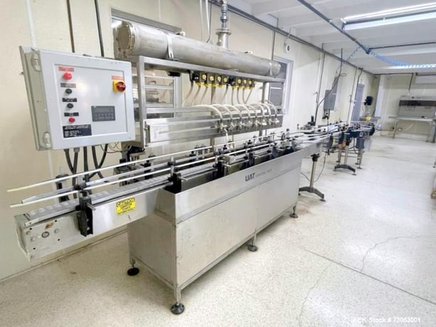 Severn Trent #UAT, Overflow Gravity Filler, 8-Head, 1 Gallon Bottles, Labeler Included, 220 V., 2002 - Image 1