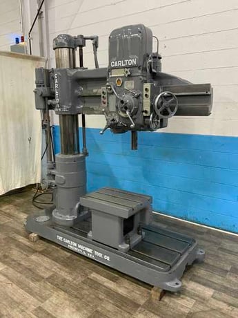 4' -9" Carlton #0A, radial arm drill, 53" x 31" base area, power elevation, coolant, box table, 5 HP - Image 1