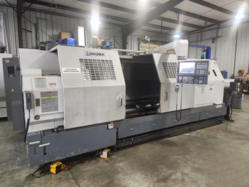 Okuma #LB-35II, CNC lathe, 27" swing, 20" chuck, 6" bar, 118" centers, 40 HP, OSP-P200L, tailstock - Image 1