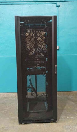 APC NetShelter SX #AR3150, 42U Wide Server Rack Enclosure, Populated Patch Panels - Image 1