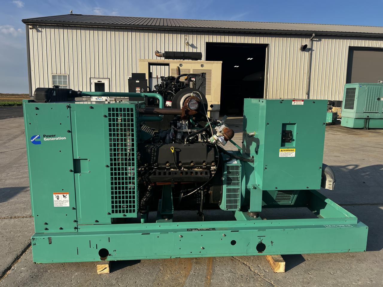 100 KW Cummins/Onan #GGHH-5554743, NG/LP generator set, 120/208 Volts, 1/3 phase, 6.8L Ford engine, base fuel - Image 1