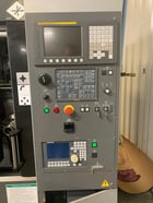 Takamaz #XW-130, Fanuc 0iTD, 8" chuck (2), 4000 RPM, 15 HP, 8 tools (2), 10 station stocker, part turnover - Image 4