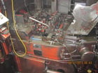 National #164, 4 die high speed nut former, 200 PPM, air clamping on feed rolls, 1988 - Image 1