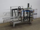 Wexxar #WF20H, automatic, in line case erector, bottom hot melt case sealer, 5-20 cases per minute, mounted - Image 1