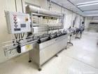 Severn Trent #UAT, Overflow Gravity Filler, 8-Head, 1 Gallon Bottles, Labeler Included, 220 V., 2002 - Image 1