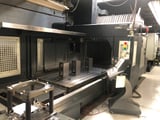 Image for Johnford #DMC-2100, 24 automatic tool changer, 81" X, 51" Y, 31" Z, 8000 RPM, #50, 30 HP, Fanuc 18iM, chip conveyor, dual chip auger, 2003