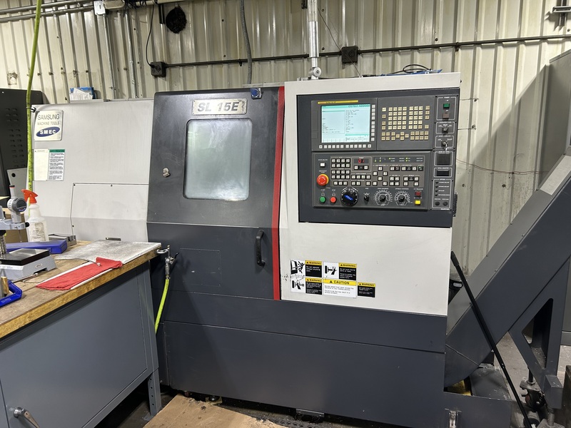 Samsung #SL15E, CNC lathe, Fanuc Oi-TF, 17.7" swing, 11.8" centers, A2-5, 2.09" bore, 6000 RPM, 10 station