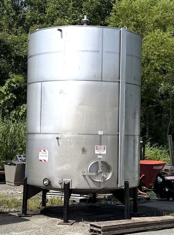 6500 gallon Stainless Steel cone bottom tank, 9' 6" diameter x 12' T/T, side manway, 4" center bottom outlet