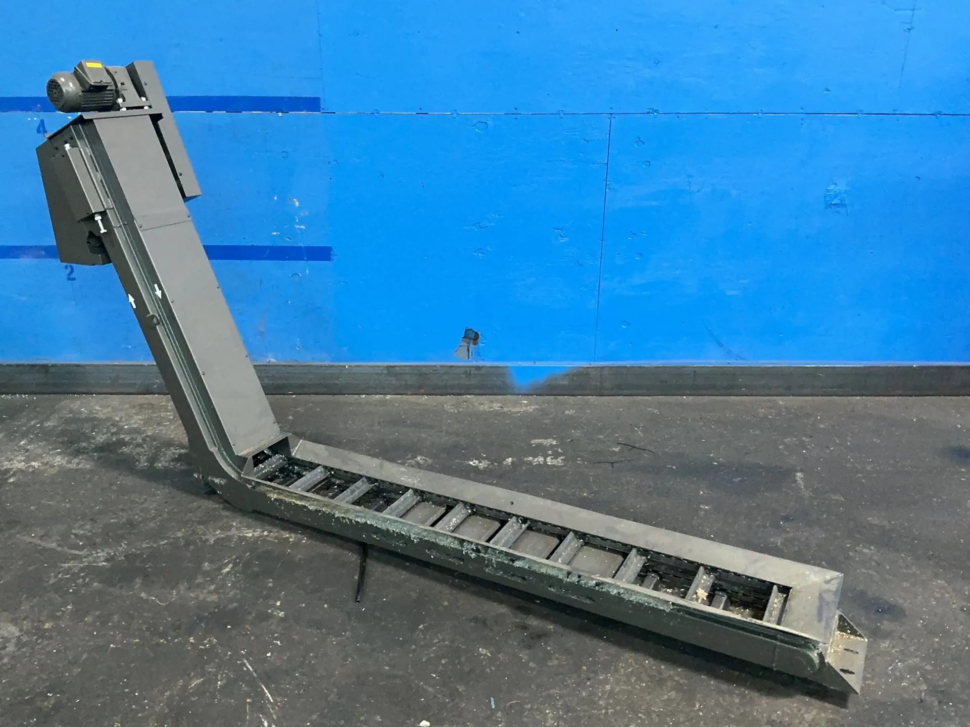 12" wide x 103" long, chip conveyor, 78" flat length, 48" chute rise, 7" flat height, 2" cleat height, .25