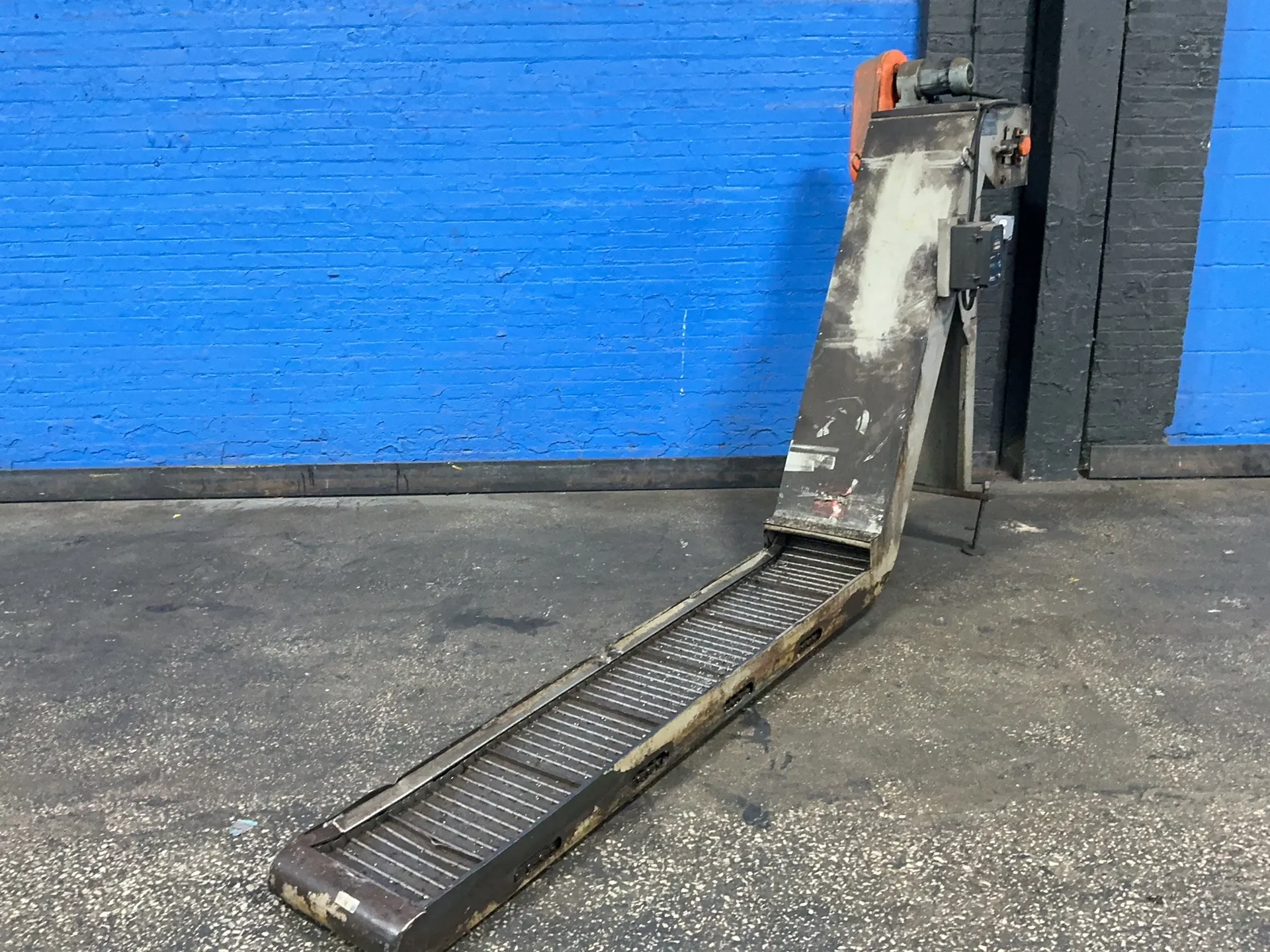 12" Jorgensen, chip conveyor, 80" flat length, 52" rise, 134" overall length, 1/2" cleats, .2 KW, speed motor