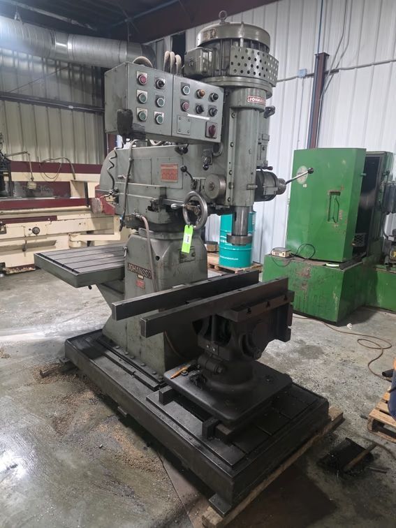 3' -12" Johansson, heavy duty sliding arm radial arm drill with universal swiveling box table