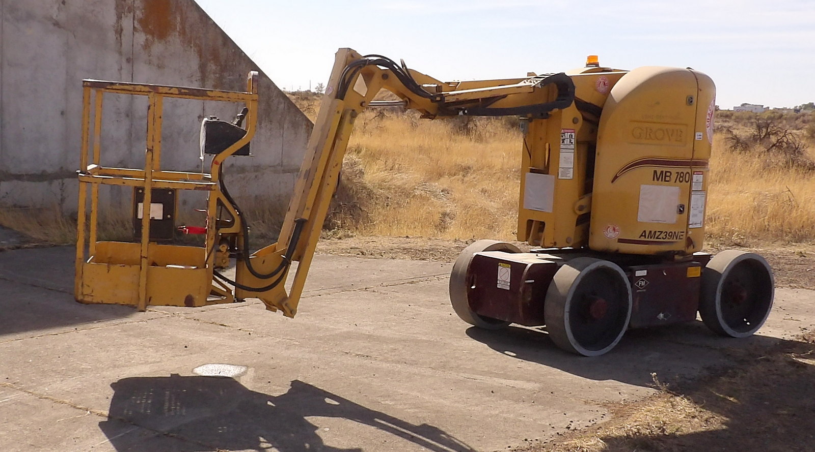 Grove #AM739NE, Telescopic Boom Man Lift, single man basket, on board charger, 6 V. batteries, basket levels