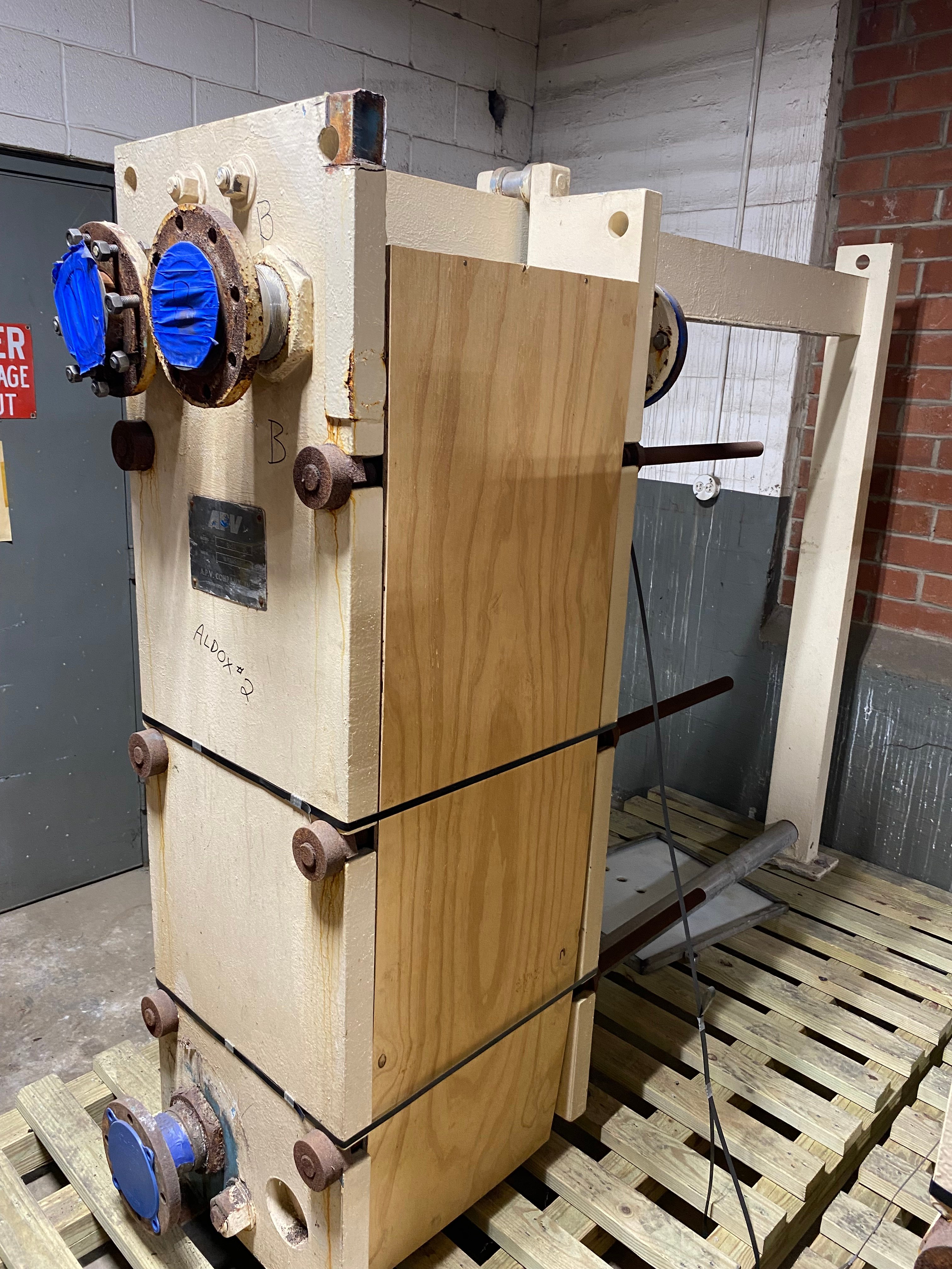 APV #R-56, Stainless Steel Plate Heat Exchanger, 18" x 20" plate bundle, (4) connections, 96" L x 22" width x