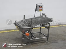Stainless steel wire belt conveyor with heated chocolate collection bin