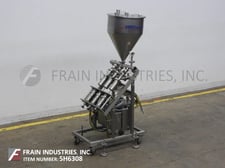 Orics #VFND1603, automatic, Stainless Steel, 3 head piston filler with 18" x 27" hopper with top cover, 5-30