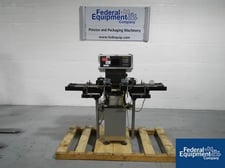 Garvens #SL2PM, 4" W x 11" L scale, 1100 gram capacity, digital controls, pwrd.side grip.belt feed/discharge