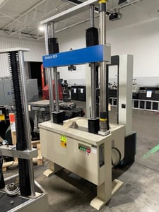 22500 lbf. (100kn) MTS/Sintec #20-G, 2 ball screw, 50" opening, 50" stroke, 25" x 6" table size