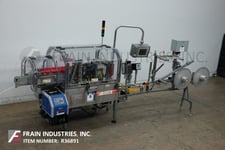 Trine #4650, Stainless steel, roll fed, hot melt glue labeler designed to apply full or partial wrap labels