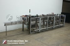Hartness #875, automatic intermittent motion Stainless Steel case packer, up to 35 cycles per minute, mounted