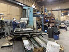 4" Tos #W100A, 49" x49" built-in rotary table, 24" facing head, tailstock, 3-Axis digital read out, 63" X