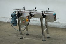 4-1/2" wide x 4.8' long, BMI / Benda Mfg, Stainless Steel table top conveyor, mounted on 4 leg Stainless