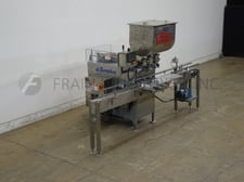 Simplex #F, inline, 2 head piston filler, rated at speeds 2-20 containers per minute, 16-128 ounces