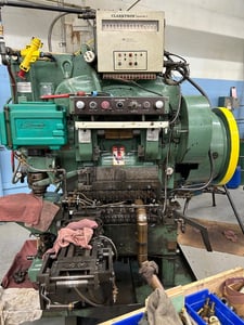 25 Ton, U.S. Baird #3-25, eyelet & transfer press, 2" stroke, 11 operation die set, Bijur Versa 3 automatic
