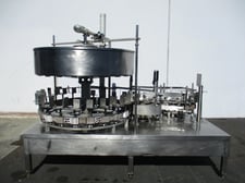 Gravity feed, 1 gallon bottle filling machine w/ 24 heads