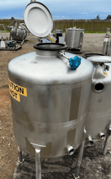 Image for 50 gallon Stainless Steel CIP Tank, 24" diameter x 24" straight side, 2.5" diameter Side-bottom outlet, 2" opening, 4" diameter Center pipe, 8" diameter Center top opening