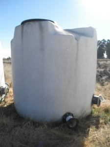 1300 gallon Plastic Storage Tank, 6' diameter x 6.5' straight side, 30" diameter Top manway, (2) 6" diameter