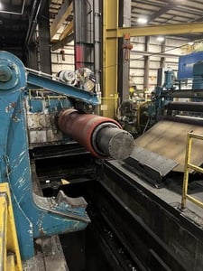 60000 lb. Denro, uncoiler with hold down roll & mandrel support arm, 72" width, 86" outside dimensions